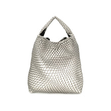 Load image into Gallery viewer, Introducing the Woven Bag (Bag in a bag), a silver PU handbag with a textured, basket-like pattern. It showcases a single strap handle and boasts a spacious, slouchy design that enhances its casual elegance. The metallic sheen combined with its intricate weave contributes to its sophisticated and stylish appearance.
