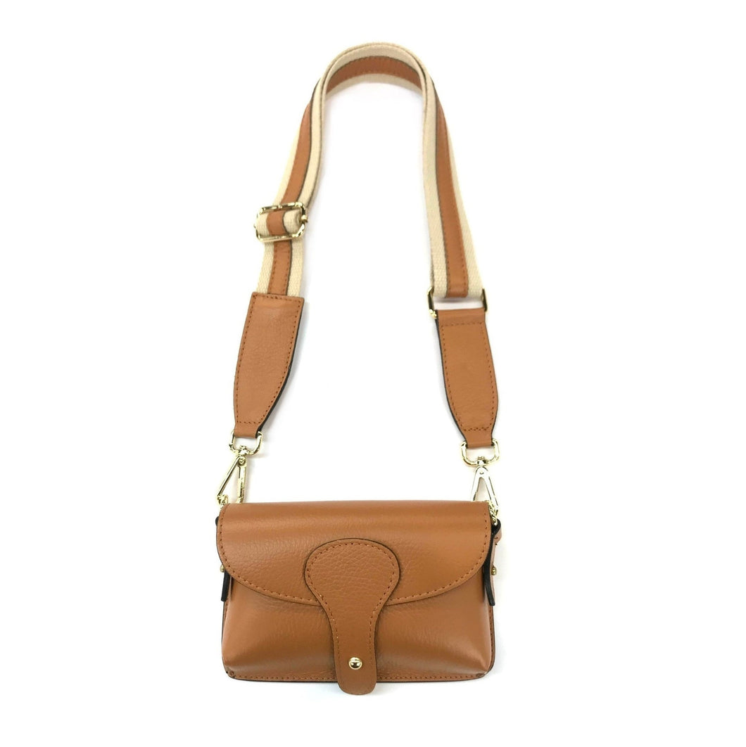 This Mini Crossbody - Leather bag, crafted from genuine leather in a deep brown hue, features a long adjustable strap. The curved flap closure is adorned with a brass button and subtle light brown accents for added elegance. Its brass hardware beautifully complements the smooth texture, making it perfect as a stylish stadium bag.