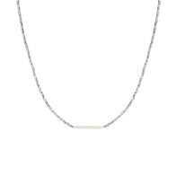 The Silver Beaded Choker with Pearl Bar, a best seller, showcases a thin horizontal bar at its center. The chain is elegant and symmetrical, with a minimalist design set against a plain white background.