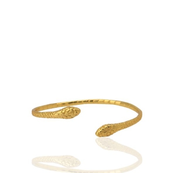 The Snake Bangle Bracelet is a handcrafted gold-plated piece featuring an open bangle design. It displays intricate scale patterns and two detailed snake heads at each end, elegantly set against a white background with a subtle shadow.