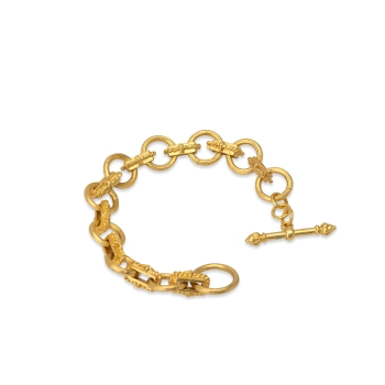 Introducing the Chain Link Bracelet with Toggle Clasp: a beautifully handcrafted piece in a 22-karat gold-plated finish. This exquisite bracelet showcases interconnected circular elements, each embellished with intricate knot-like designs. Its polished surface captures and reflects light brilliantly against a white background, emphasizing its timeless elegance.