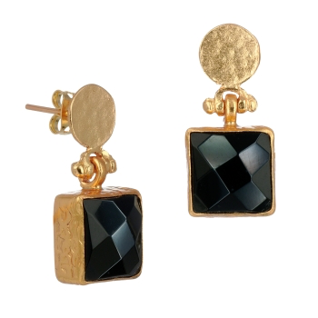 A close-up of the Onyx Earrings showcases their elegant design, starting with a round, textured gold-plated stud at the top. Dangling below is a square black gemstone with a faceted surface, beautifully secured in an intricate gold setting. The earring post and backing are visibly integrated into the design.