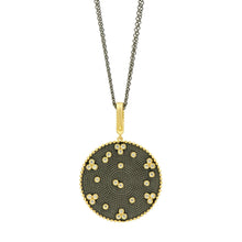 Load image into Gallery viewer, The Signature Double Sided Pendant Necklace features a round cubic zirconia pendant adorned with sparkling stones, suspended from a black rhodium chain. Its dark textured surface is embellished with numerous small, shiny gems arranged in a scattered pattern and bordered by elegant gold detailing for a sophisticated appearance.
