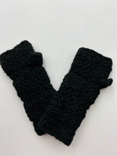 Load image into Gallery viewer, A pair of Wool Knit Fingerless Gloves, crocheted in black with a floral pattern, are displayed side by side on a plain white background. Made from soft sheep wool, these gloves boast intricate stitching and a thumb opening. For lasting quality, gentle hand washing is recommended.
