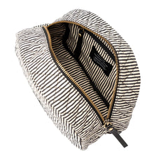 Load image into Gallery viewer, The Moon Makeup Bag - Cotton/Black Classic Leather is unzipped, showing off its matching black and white striped interior. Made from recycled cotton, it features a quilted texture for extra charm. Inside, a black label adorns the lining. The black zipper pull stands out against the gold zipper teeth.
