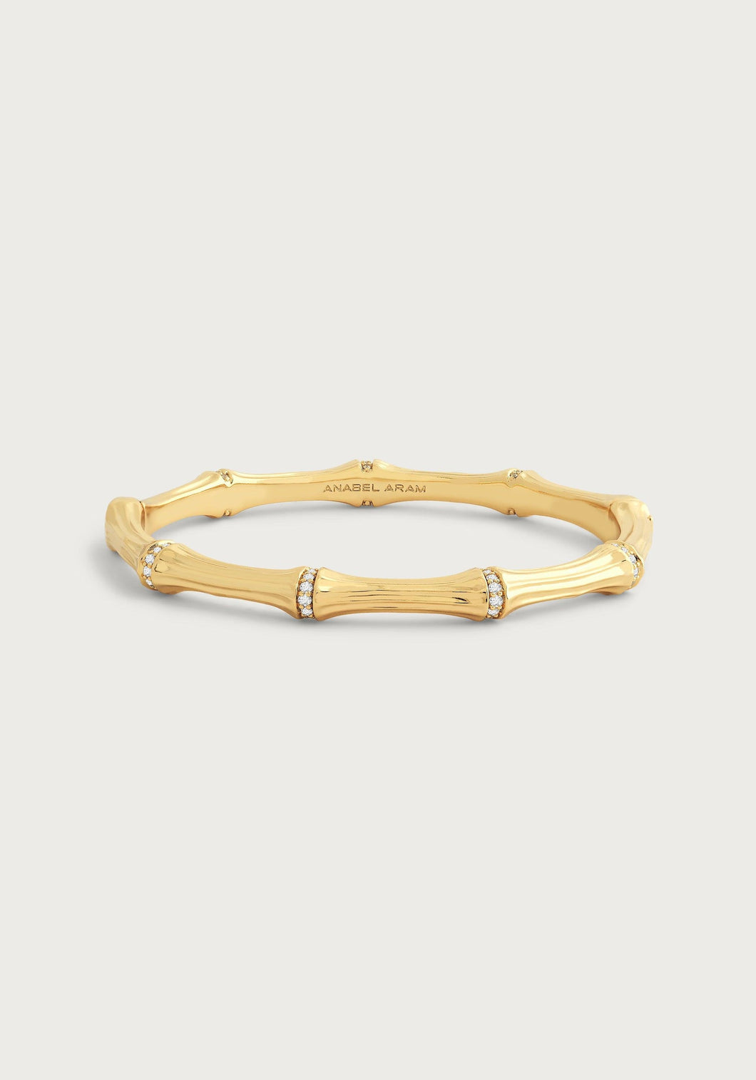 The Bamboo Hinged Bangle is exquisitely designed with smooth, curved segments that are embellished with sparkling crystals. The engraving of 