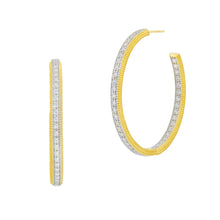 Load image into Gallery viewer, Close-up of &quot;The Icon - Pave Hoop Earrings,&quot; featuring an elegant dual-tone design with a bright yellow gold outer edge and a pavé stone-embellished inner side for a textured look. The earrings open at the top and include a secure post for wearing.
