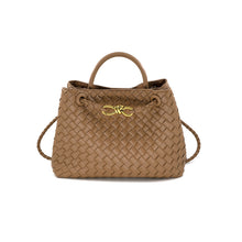 Load image into Gallery viewer, The Talene Crossbody Bag is a brown woven leather handbag with a structured design, featuring round handles, a detachable shoulder strap, and gold-tone hardware with a knot detail on the front. This stylish crossbody bag includes an interior pocket and magnetic closure for enhanced functionality.
