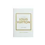 The "Little Book of Louis Vuitton" features a white cover with "Louis Vuitton" prominently displayed in bold gold letters centered within a gold square border, embodying the brand's expertise in luxury fashion. Below, the text reads "A Passion for Excellence" in smaller gold letters. The minimalist and elegant design captures the charm of their iconic monogrammed bags.