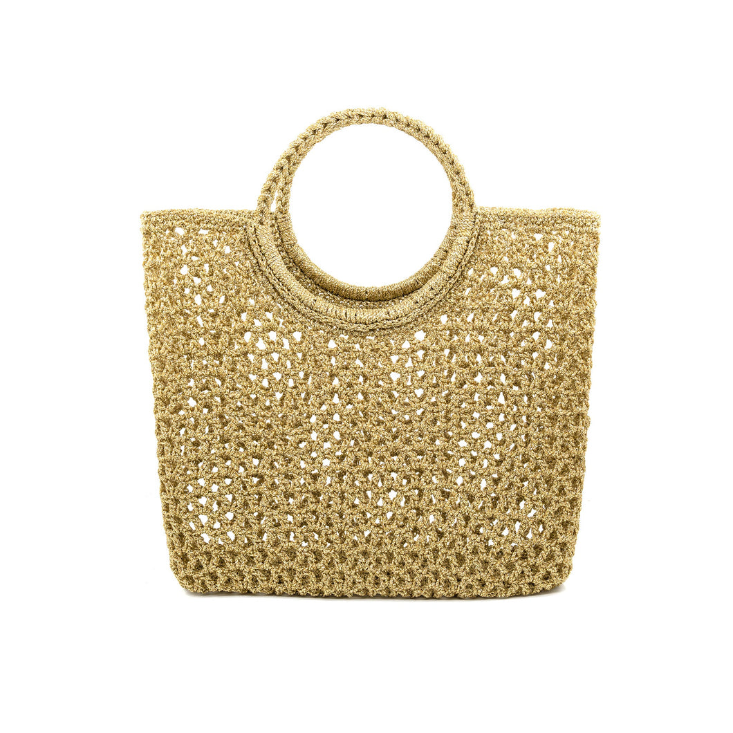 The Costa Bella Bag is a tan woven straw accessory with a rectangular shape, showcased against a white background. It has a crochet-like mesh pattern and circular handles made from the same material for a cohesive, natural look.