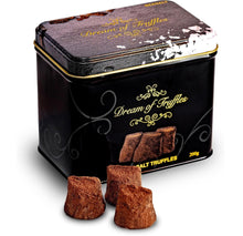 Load image into Gallery viewer, A decorative black tin labeled &quot;Cocoa Dusted Truffles&quot; offers a gourmet indulgence with its intricate design and contains 200g of truffles. Slightly open, it reveals dark chocolate coating. Three rustic truffles covered in cocoa powder sit in front, ideal for a luxurious gift.
