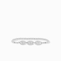 Load image into Gallery viewer, The Pave Anchor Link Stretch Beaded Bracelet combines small round beads with three larger oval, crystal-encrusted decorations. Its symmetrical elegance is accentuated by subtle anchor links, all set against a plain white background.
