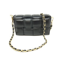 Load image into Gallery viewer, The Leather Quilted Bag is crafted from luxurious Italian black leather, featuring a large square pattern. It includes a gold chain crossbody strap interwoven with black leather and attached to gold hardware, all set against a plain white background for an elegant look.
