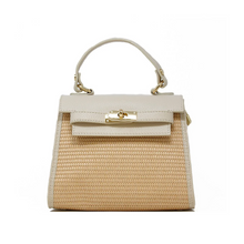 Load image into Gallery viewer, The Raffia Leather Bag is a tan-and-cream, rectangular handbag with a woven body and Italian leather accents. It features a structured design, a top flap with a gold twist-lock clasp, and an adjustable handle with gold hardware for added versatility and sophistication.
