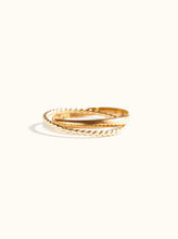 Load image into Gallery viewer, Two exquisite Virgil Rings are intertwined against a plain white background. One ring, featuring a simple gold-fill band, beautifully complements the other with its twisted rope design. Their arrangement casts a soft shadow below, enhancing the minimalist elegance of this handmade jewelry piece.
