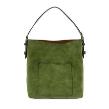 Load image into Gallery viewer, Introducing the Hobo 2 in 1 Faux Suede Handbag, a green accessory with a sleek rectangular silhouette and a practical front pocket. It features a dark brown vegan leather strap accented by gold-tone hardware and an optional removable crossbody strap. The interior is lined with brown material, enhancing its elegant design.
