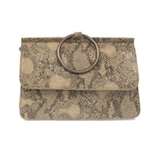 Load image into Gallery viewer, The Aria Ring Bag - Fall/Winter features a sleek snakeskin-patterned design in beige and brown vegan leather, highlighted by a prominent round metal ring handle affixed to its flap. Its textured surface showcases a variety of shades and scales, adding depth to the bag&#39;s elegant form. With its sophisticated yet adaptable style, it suits both formal and casual occasions perfectly.
