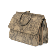 Load image into Gallery viewer, The Aria Ring Bag - Fall/Winter showcases a sophisticated design with its beige, snake-print vegan leather and prominent large metal ring on the flap, reminiscent of a bracelet bag&#39;s elegance. Its structured rectangular shape is angled to emphasize the neatly stitched edges and matte finish.
