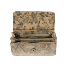 Load image into Gallery viewer, Introducing the Aria Ring Bag - Fall/Winter: This stylish open beige wallet showcases a snakeskin texture and a floral print interior, all crafted from high-quality vegan leather. It features a spacious main compartment with a zipper, complemented by additional sections for optimal organization. The wallet is secured with a convenient button clasp for closure.
