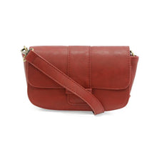 Load image into Gallery viewer, Introducing the Becca Baguette Convertible Crossbody, a compact red bag crafted from vintage vegan leather. This crossbody showcases a flap closure, gold-tone hardware, and an adjustable strap. Its smooth texture and minimalist design create a timeless, versatile appearance against a plain white background.
