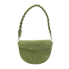 Load image into Gallery viewer, The Luna Crescent Crossbody with Braided Handle, made from green vegan suede leather, showcases a semi-circular design and a flap closure. It includes a braided shoulder strap connected with gold-tone hardware, offering a smooth, velvety finish for a chic and sophisticated look.
