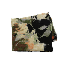 Load image into Gallery viewer, A Midweight Patterned Scarf features a floral design in shades of green, orange, and cream set against a black background. The soft fabric is neatly arranged in a rectangular shape, making it the perfect addition to enhance the elegance of any outfit.
