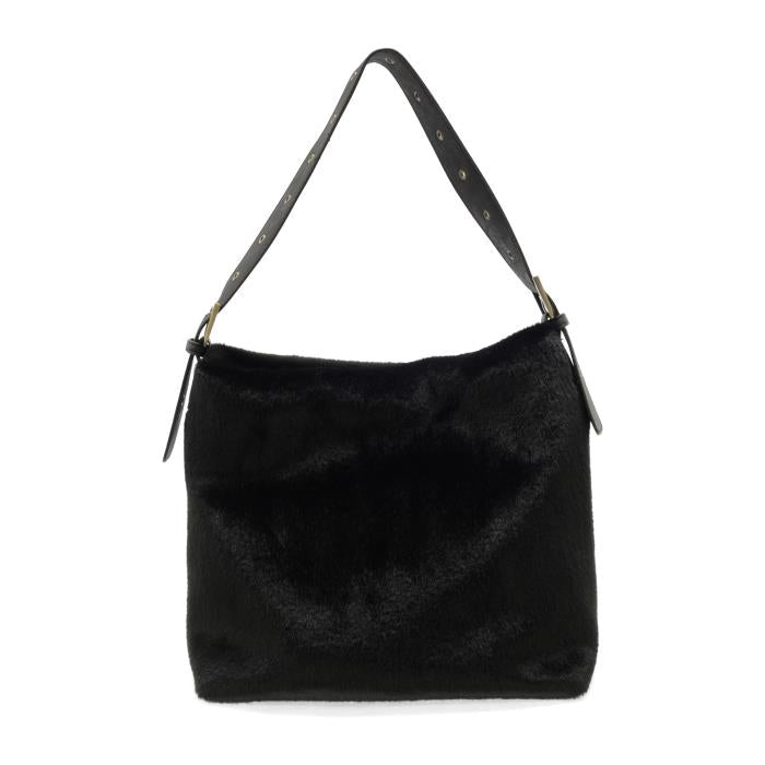 The Teresa Faux Fur Hobo, a chic and sophisticated black faux fur handbag, is displayed. It boasts a smooth texture and features a wide, adjustable black leather shoulder strap adorned with metal studs. Its simple rectangular shape is elegantly highlighted against the plain white background, perfectly showcasing the vegan leather bag.