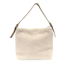 Load image into Gallery viewer, Introducing the Teresa Faux Fur Hobo: a cream-colored, rectangular handbag featuring a luxurious soft, faux fur texture. This elegant bag includes a single adjustable shoulder strap crafted from brown vegan leather and enhanced with gold buckle accents on each side. Its minimalist design and neutral tones make it a versatile accessory for any wardrobe.
