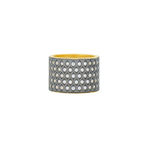 The New Icon Cigar Band features a wide, cylindrical metal ring decoratively embellished with a diamond pattern of small, clear cubic zirconia stones. The interior displays a golden hue, contrasting with the darker, textured metallic finish on the exterior. This striking pavé ring is showcased against a plain white background.