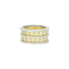 Load image into Gallery viewer, Introducing the Two Tone 5-Stack Ring, a breathtaking creation featuring three stacked bands—two in sterling silver and one gleaming in 14K gold. Each band is beautifully embellished with cubic zirconia stones, offering intricate detailing that transforms this polished piece into a true statement accessory.
