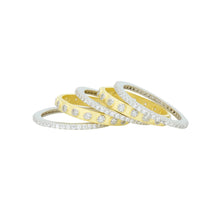 Load image into Gallery viewer, The Two Tone 5-Stack Ring features a stunning arrangement of five rings, alternating between 14K yellow and white gold. Each ring is embellished with small, round cubic zirconia stones, creating a visually appealing intertwined pattern that highlights the contrast between the gold hues and the sparkling gemstones.
