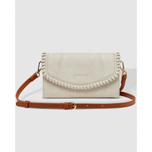 Load image into Gallery viewer, The Harlow Crossbody Bag showcases a cream-colored style, complete with an adjustable crossbody strap and decorative stitching on the flap. Made from vegan leather, it includes subtle embossing and a gold-tone clasp, all set against a simple light gray background.
