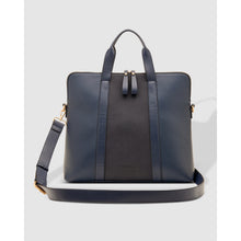 Load image into Gallery viewer, The Rhodes Suede Laptop Bag is an elegant leather briefcase featuring a front panel in black and dark blue. It comes with dual handles and an adjustable shoulder strap adorned with gold-tone hardware. The bag boasts a streamlined rectangular design, with a discreet brand logo embossed near the bottom on the front.
