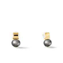 Load image into Gallery viewer, The Smooth + Classic Pebble Pearl Post Earrings showcase sophisticated gold earrings with a sleek black pearl gracefully hanging below a polished 14 karat gold rectangular stud. These minimalist pearl earrings come with hypoallergenic backing and are photographed against a plain white background.
