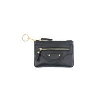 Load image into Gallery viewer, Introducing the Leather Wallet with Keychain: It’s a compact black leather coin purse showcasing a textured surface. The purse includes a zipper pocket adorned with a gold zipper and highlighted by a charming smile-like design featuring gold stud accents. Additionally, it has a keyring affixed to one corner via a short gold chain for added convenience.
