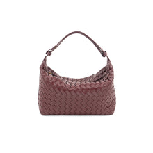 Load image into Gallery viewer, A Woven Handbag crafted from vegan leather is featured against a plain white backdrop. The handbag boasts a textured design with a complex interlaced pattern and is presented in deep burgundy. Its rounded handle enhances the bag&#39;s sophisticated appearance.
