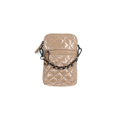 The Patent Quilted Cellphone Bag is a stylish accessory featuring a shiny beige, quilted design with a diamond pattern. It includes a front zip pocket and a black chain strap, crafted from luxurious nylon material. The circular zipper pull adds charm, while metal hooks attach the strap on each side, highlighted against a white background to accentuate its elegance.