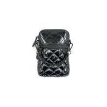 Load image into Gallery viewer, The Patent Quilted Cellphone Bag is a small, shiny black accessory with a quilted design featuring diamond-pattern stitching. It includes a front zipper pocket and chain detail with a knot accent. Made from nylon, it boasts a sleek and textured appearance, and it comes with a detachable strap secured by clips on both sides.
