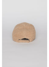 Load image into Gallery viewer, Displayed against a plain white background is a Sherpa Cap in tan fleece, featuring a textured teddy bear design. This baseball hat showcases an adjustable strap at the back, highlighting the soft and fuzzy sherpa material that makes it ideal for fall and winter fashion.
