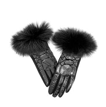 Load image into Gallery viewer, Introducing the Metallic Puffer Glove with Fox Trim: a sophisticated pair of black leather gloves featuring luxurious, fluffy fox fur trim. The gloves are designed with intricate stitched detailing on the back, creating a striking quilted pattern against a white background. This full and soft fur trim adds an elegant, stylish touch to the classic leather design.
