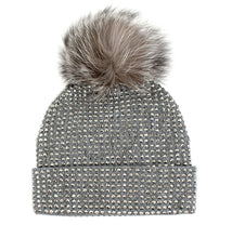 Load image into Gallery viewer, The Knit Crystal Beanie with Fox Fur Pom-Pom comes in a soothing gray hue, sparkling with rhinestones and topped with a large, fluffy faux fur pom-pom. Its fold-over cuff enhances the texture and style of the design, offering both warmth and chic elegance for your winter wardrobe.
