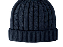 Load image into Gallery viewer, Close-up of the Cable Knit Beanie with Fleece Lining, featuring a black design with a ribbed folded brim. The main body displays a vertical cable knit pattern accentuated by its warm fleece lining. The beanie is set against a clean, white background that highlights its texture and details.
