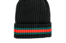 Load image into Gallery viewer, The Knit Hat with Striped Cuff is a black knitted hat featuring a folded brim adorned with two horizontal stripes, one in red and the other in green, circling the cuff. The ribbed texture adds to its cozy aesthetic.
