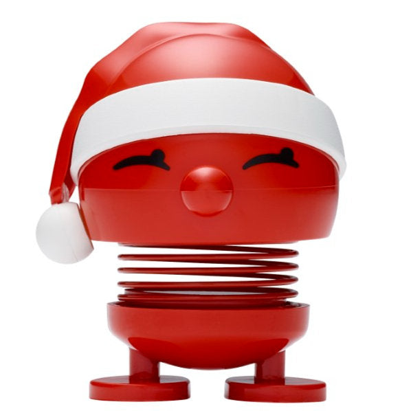 The Hoptimist Santa is a delightful red, round spring toy adorned with a cheerful face and a festive Santa hat, making it perfect for Christmas decorations. Its closed, curved eyes and spherical nose add charm as it stands on two flat feet with its body being a coiled spring, making it an ideal choice for Advent calendar gifts.