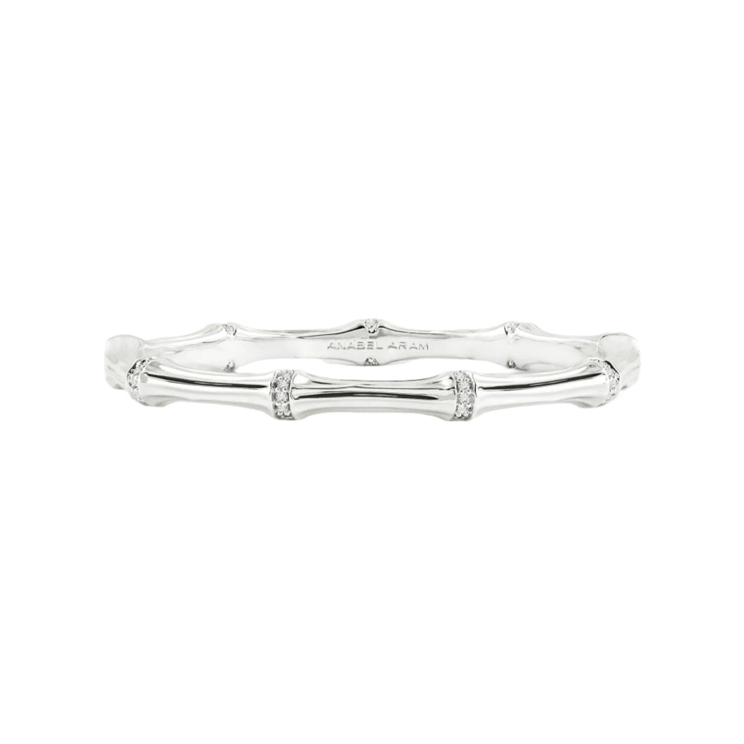 The Bamboo Hinged Bangle - Silver features textured nodes and smooth segments on a soft gray backdrop. Engraved with 