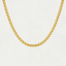 Load image into Gallery viewer, The Tokyo Chain Necklace is displayed on a plain white background, showcasing interlocking gold-plated oval links with a polished finish. This adjustable necklace elegantly curves to highlight its flexibility and craftsmanship.
