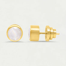 Load image into Gallery viewer, The Signature Midi Studs from Dean Davidson showcase round man-made gemstones set in gold. One earring is front-facing, displaying the stone encased in gold, while the other shows the side view against a light gray background, highlighting the post and butterfly backing.
