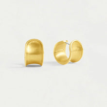 Load image into Gallery viewer, On a plain white background, the Sol Huggie Hoops, crafted in brushed gold-plating, are displayed side by side. Each hypoallergenic earring features a smooth, slightly curved surface with an open back and gleams with a shiny polished finish.
