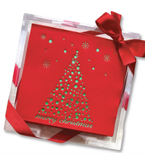 Load image into Gallery viewer, Stylish red Christmas card elegantly packaged in a clear box, makes for an ideal hostess gift. It showcases a stylized Christmas tree crafted from tiny green stars and dots, accompanied by &quot;merry christmas&quot; in green lettering. The box is adorned with a red satin ribbon and bow, while delicate snowflake motifs embellish the card.
