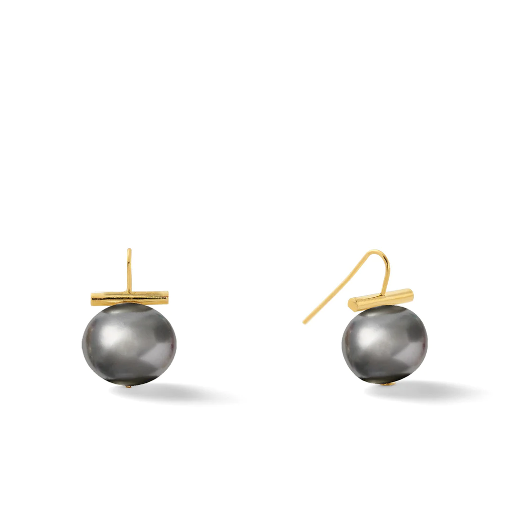 Introducing the Classic Forever Fave Pebble Pearl Earrings: a sophisticated pair showcasing large round pebble pearls. Each pearl elegantly dangles from a minimalist 14 karat gold handmade ear wire, with a sleek horizontal gold bar above each pearl for a contemporary flair. The earrings are displayed against a simple white background, highlighting their timeless design.